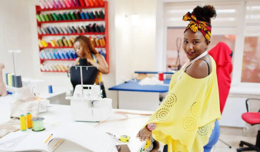 Tailors working at SMEDAN sewing hub with steady electricity and free sewing machines in Abuja.